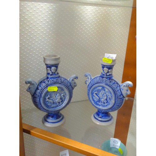 620 - A pair of neo classical style flasks decorated with rams heads and country scene. Has a registration... 