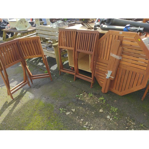 90 - Teak garden table with four chairs (all parts of table for assembly are present.)