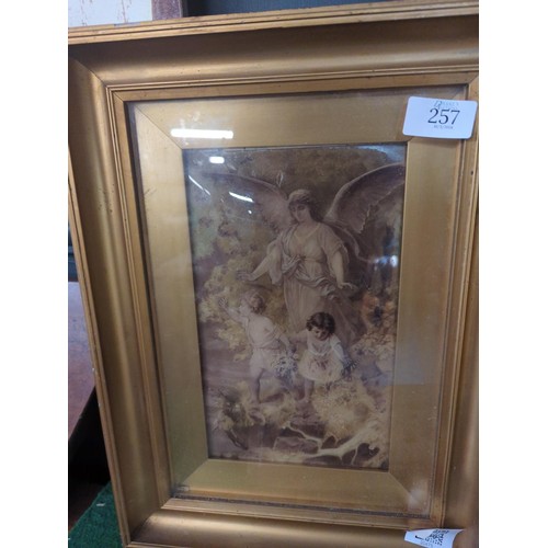 257 - Victorian reverse glass transfer crystoleum print depicting an angel with two children, in gilt fram... 