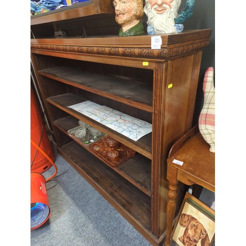 323 - Large Victorian mahogany open adjustable bookcase with carved frieze. W137cm D28cm H112cm