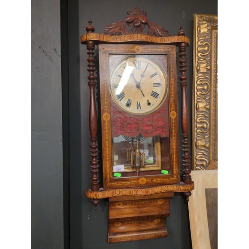 340 - Inlaid wall clock. Inscribed Waterbury clocks.