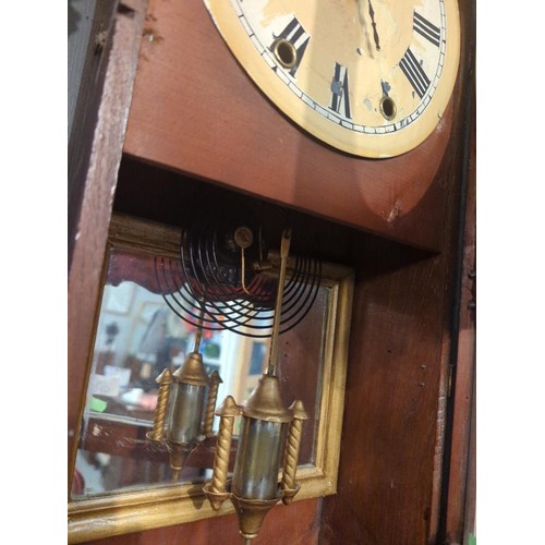 340 - Inlaid wall clock. Inscribed Waterbury clocks.