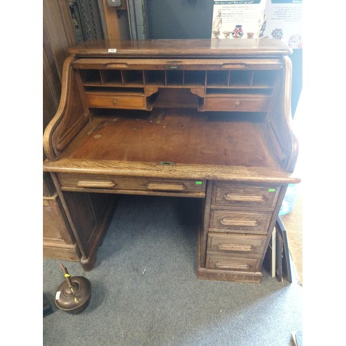 374 - Oak tambour fronted desk. W 107 x D78 x H112cm