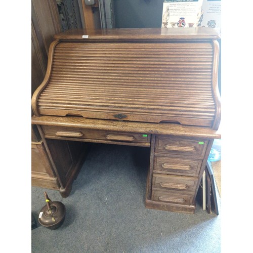 374 - Oak tambour fronted desk. W 107 x D78 x H112cm