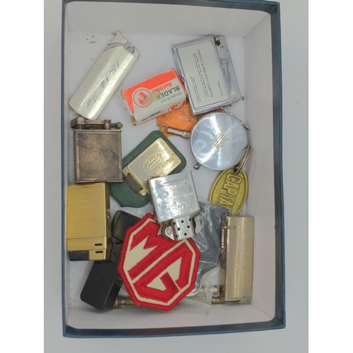 717 - Box of collectables Inc. lighters etc.