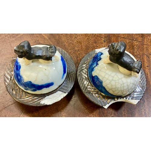 619 - Two blue and white lidded jars with Chinese mark to base and finial decoration. 