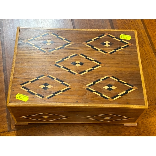 217 - Inlaid wooden jewellery casket with two layers and seven internal compartments. W29 D20H12 cm