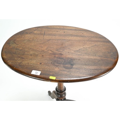 32 - Oval topped mahogany pedestal occasional table.  60 x 45 Dia. x 71.5 height.