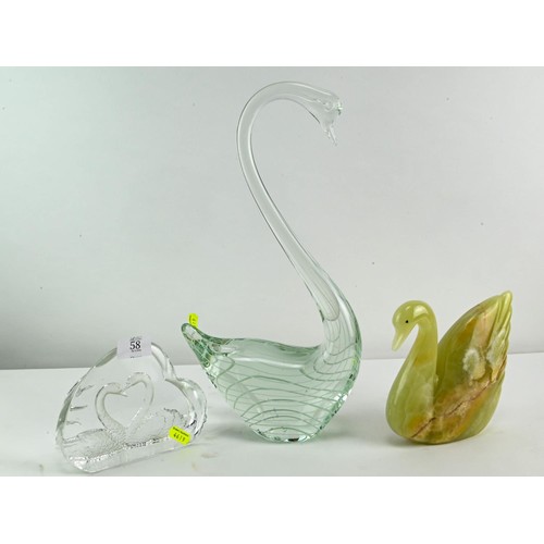 58 -  Two studio glass swans and an onyx swan.