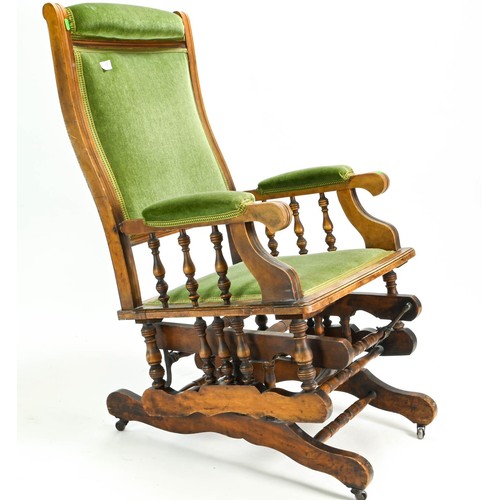 61 - American rocking chair upholstered in green velvet