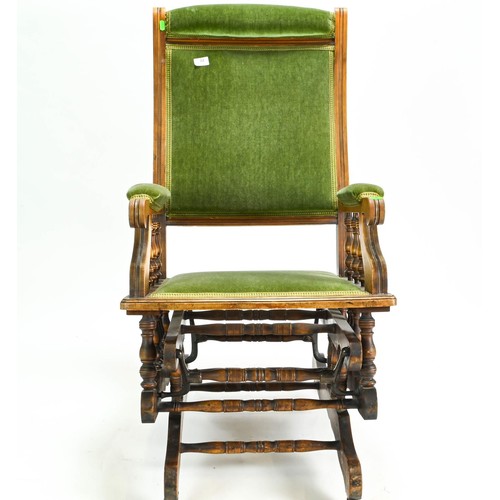 61 - American rocking chair upholstered in green velvet