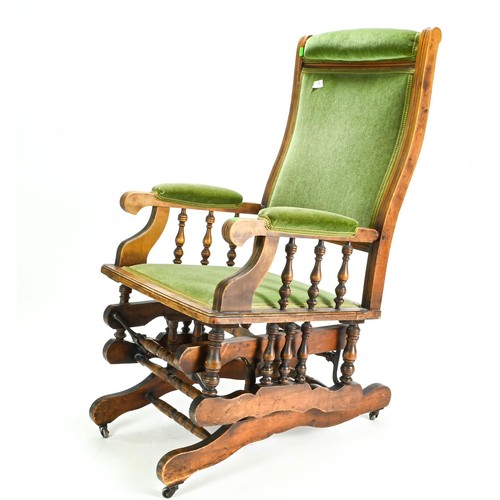 61 - American rocking chair upholstered in green velvet