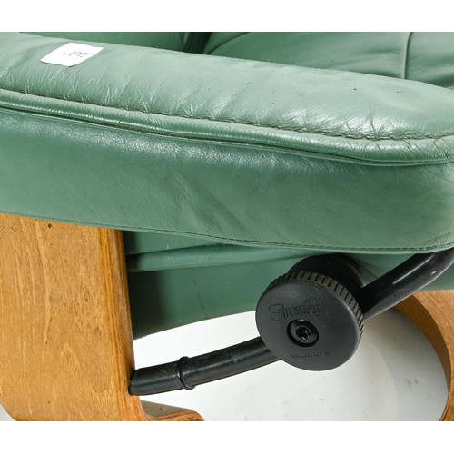 78 - Ekornes stressless reclining chair in green height of 99cm approx. plus a brown foot stool