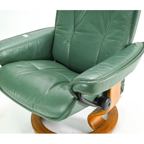 78 - Ekornes stressless reclining chair in green height of 99cm approx. plus a brown foot stool