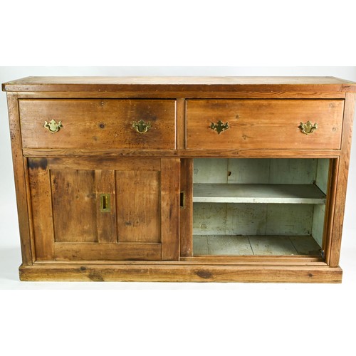 8 - Pitch pine Victorian sideboard. Featuring two drawers over sliding cupboard with brass handles.  W15... 