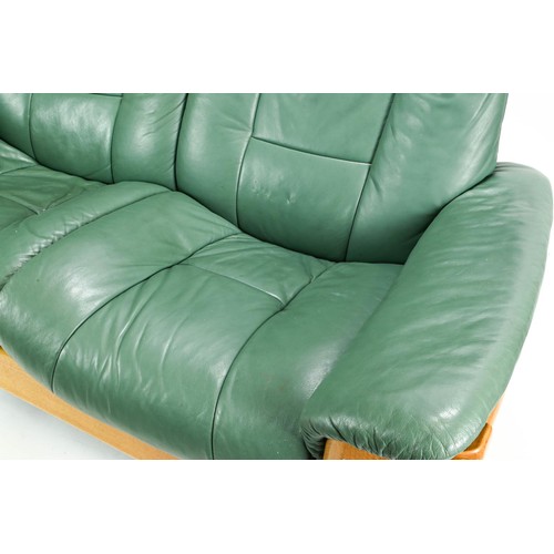 77 - Ekornes stressless reclining 2 seater sofa in green  148 width, 71cm depth,  101cm height,