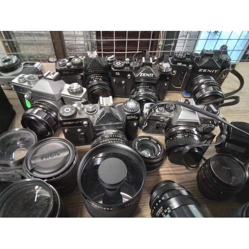 1307 - Variety of vintage manual cameras Inc, 35mm SLR 's, Viewfinders and instant plus lenses, filters, ex... 