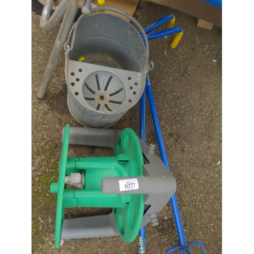 1077 - Fold up wheel barrow, galvanised bucket, hose reel Etc..