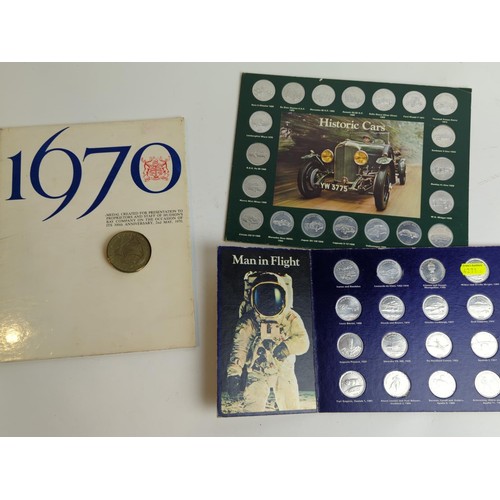 372 - Two Shell commemorative coin sets, including 'Historic Cars' and 'Man in Flight', together with... 