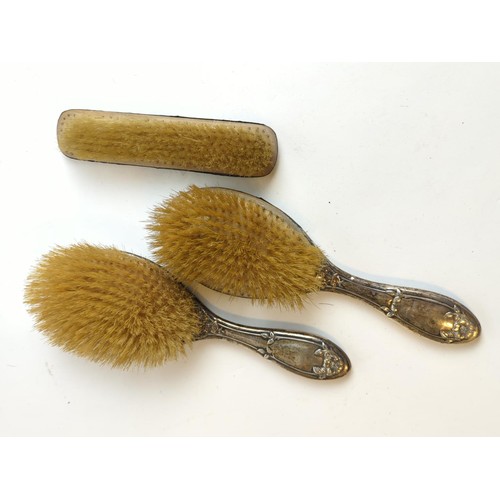 435 - Pair of Birmingham hallmarked silver backed hair brushes and another Birmingham hallmarked brush