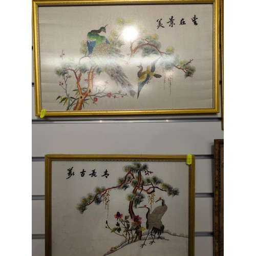 108 - Three framed Chinese silk embroideries of birds. largest 30cm x 48cm.