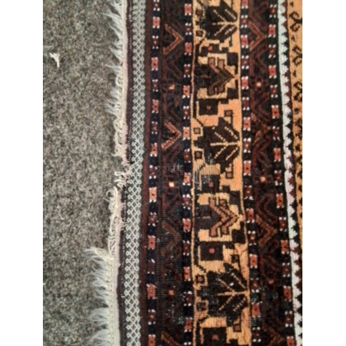 130 - Hand finished fringed Persian rug with Aztec style design . 234 x 118 cm