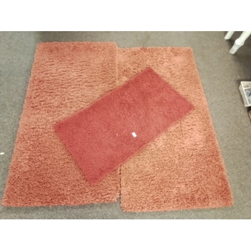 134 - Three modern Slumber rugs made in Turkey Two terracotta 150 x 80 cm and Emily Shaggy 110 x 60 cm in ... 