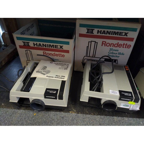 1023 - Two Hanimex Rondette 1500RF photographic slide projectors. Both have original boxes and instructions... 