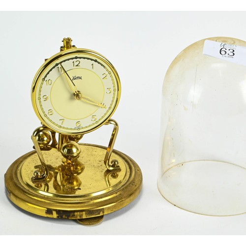 63 - Koma clock with plastic dome, ht. 17cm
