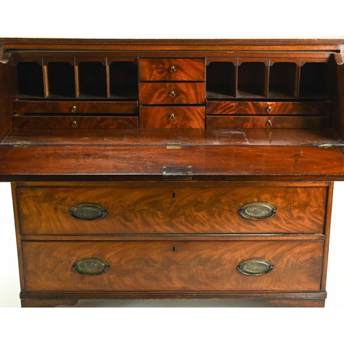 75 - Flame mahogany secretaire with three lower drawers, drop down writing shelf with eight pigeon holes ... 