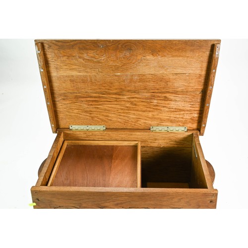 84 - Oak Arts and Crafts style workbox with carved front and inner tray W72 x D43 x H52cm
