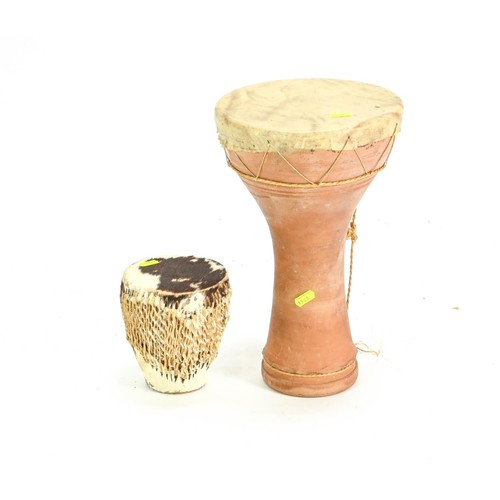 114 - Two skin drums, one with terracotta base