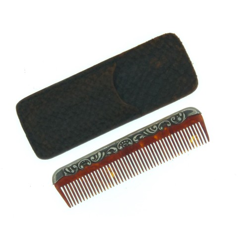 321 - Small silver mounted comb in leather pouch, marked Sterling, comb length 7.7cm