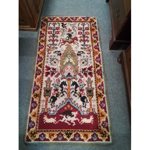 131A - Hand made deep pile rug with large border and centre composition depicting horses and riders and a h... 