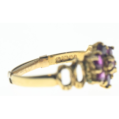 72 - Pink sapphire, flower cluster ring on 9ct gold featuring openwork shoulders. Gross weight 2.27g