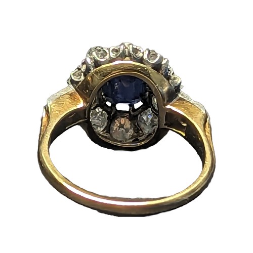 85 - Sapphire and diamond halo cluster ring. The central rectangular cushion cut sapphire is approximatel... 