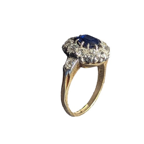 85 - Sapphire and diamond halo cluster ring. The central rectangular cushion cut sapphire is approximatel... 