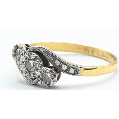 114 - 18ct gold and diamond crossover ring, size Q. Gross weight 2.63g