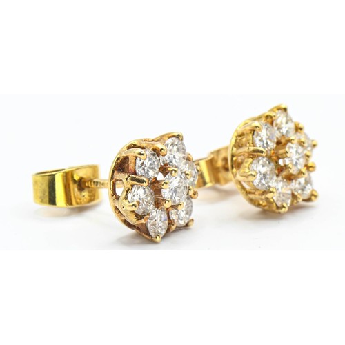 124 - Diamond cluster earrings set in 18ct gold. Head diameter approximately 8.2mm at widest point. Gross ... 