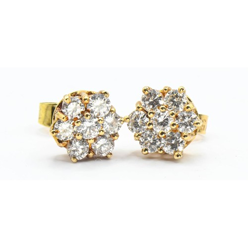 124 - Diamond cluster earrings set in 18ct gold. Head diameter approximately 8.2mm at widest point. Gross ... 