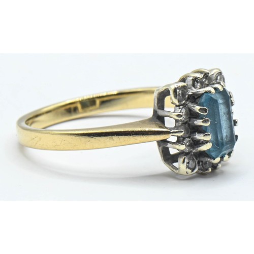 175 - Topaz and diamond cluster ring. An emerald cut topaz surrounded by diamonds on 9ct gold. Size J 1/2.... 