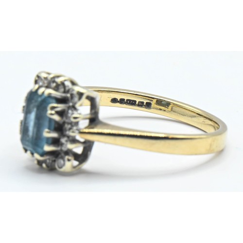 175 - Topaz and diamond cluster ring. An emerald cut topaz surrounded by diamonds on 9ct gold. Size J 1/2.... 