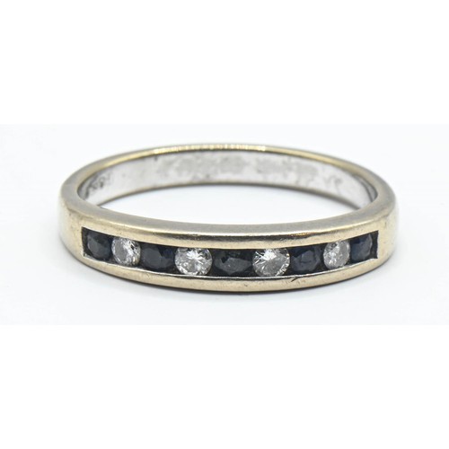 181 - Diamond and sapphire channel set 18ct white gold ring. Size L 1/2. Gross weight 3.43g