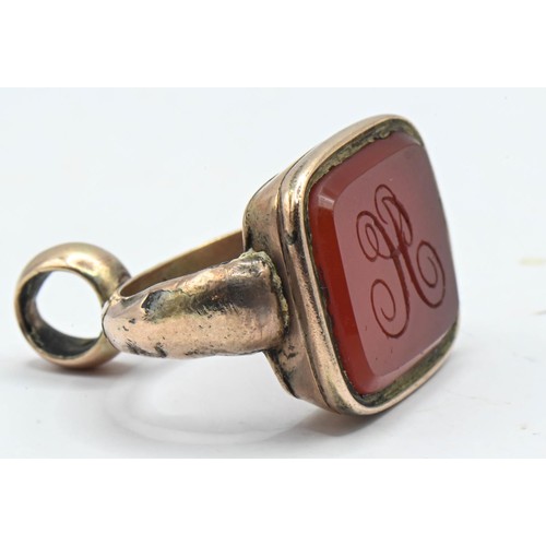 184 - Yellow metal carnelian set fob engraved with 'H' Gross weight 7.64g