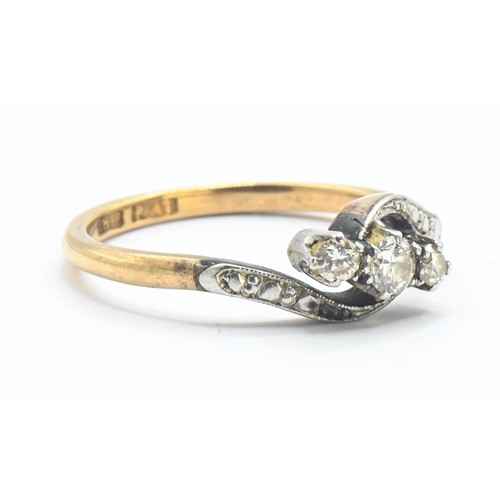 71 - 18ct gold and diamond crossover ring, size M 1/2. Gross weight 2.62g.