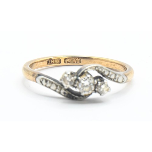 71 - 18ct gold and diamond crossover ring, size M 1/2. Gross weight 2.62g.