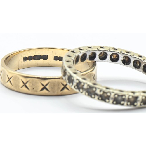 78 - Two 9ct gold rings, including an eternity ring set with white stones and the other with a continuous... 