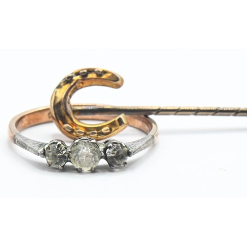 80 - 15ct gold horse shoe stick pin (1.18g) together with a paste set ring marked 9ct (1.63g).