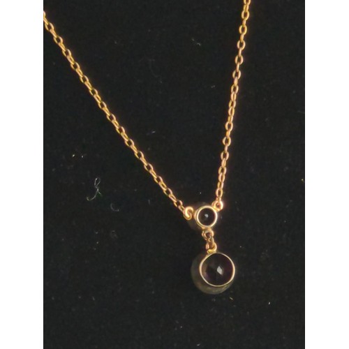 167 - 9ct gold and amethyst pendant on a 9ct gold chain. The two amethysts are modified brilliant cut in a... 