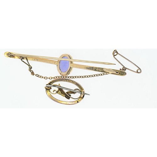 155 - 15ct gold bar brooch set with a purple paste stone, gross weight 3.43g, together with a small 9ct go... 